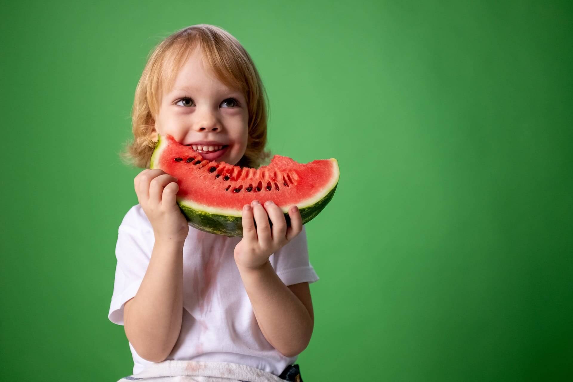 Smiling Kid Eating Watermelon