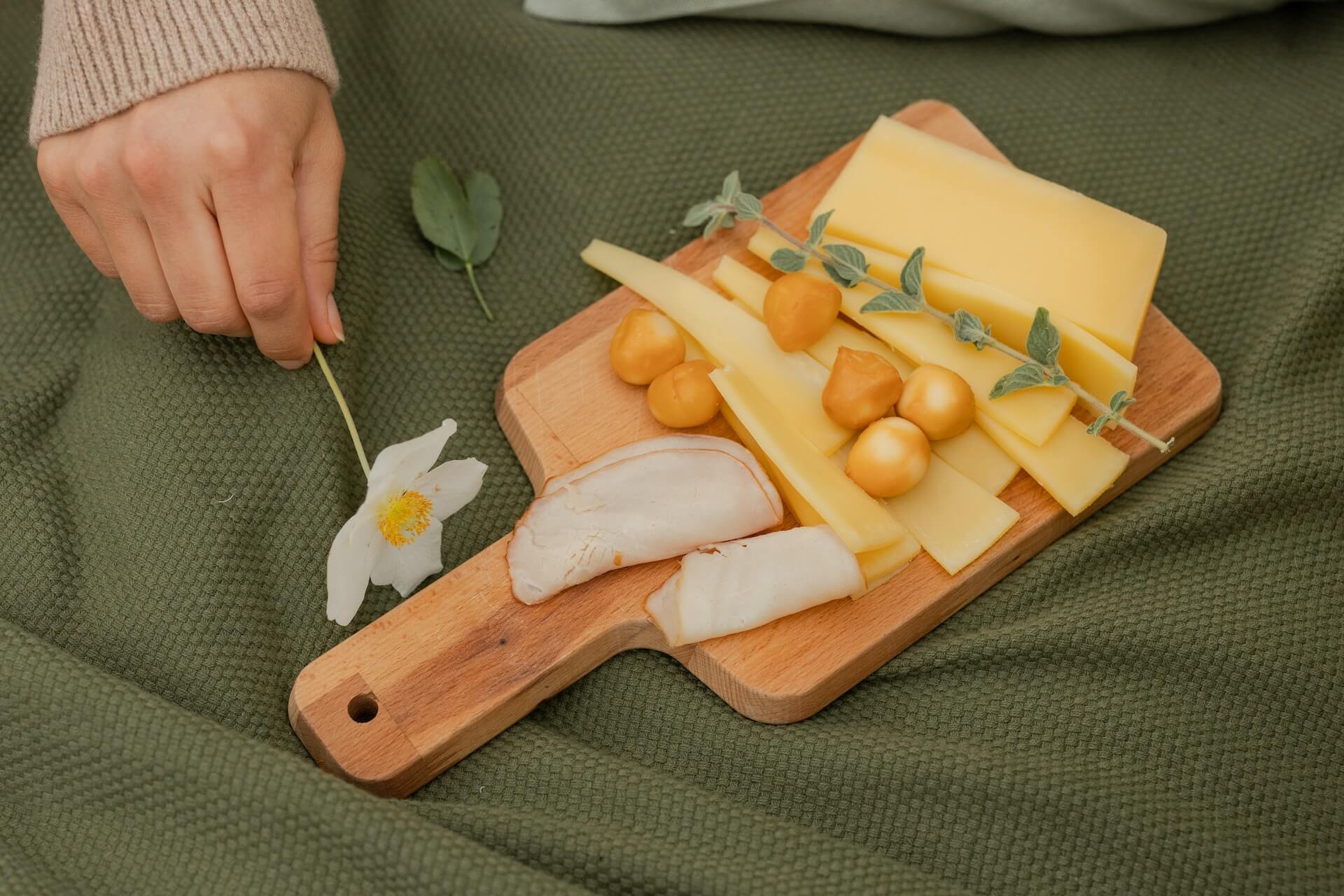 cheddar cheese on top of wooden board